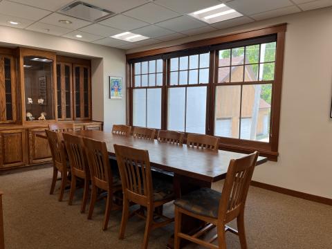 Image of a table and chairs in the Wisconsin Room at the Dwight Foster Public Library.