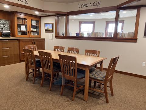 Image of a table and chairs in the Niedecker Room at the Dwight Foster Public Library.