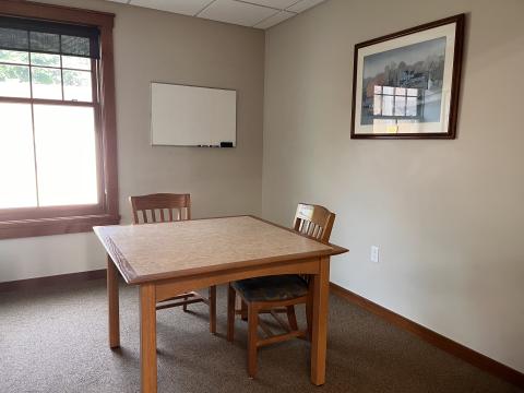 Image of a table and chairs in the Boyer Room at the Dwight Foster Public Library.