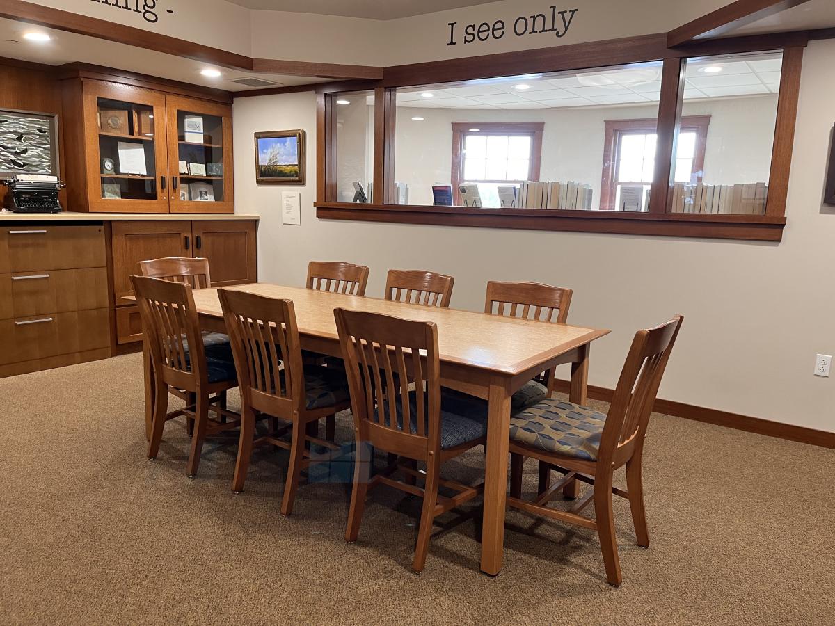 Image of a table and chairs in the Niedecker Room at the Dwight Foster Public Library.
