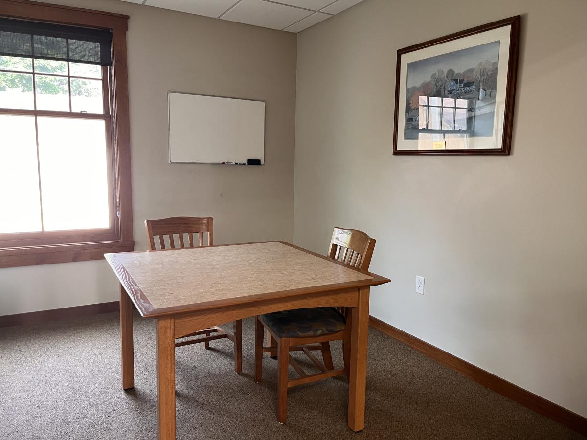 Image of a table and chairs in the Boyer Room at the Dwight Foster Public Library.